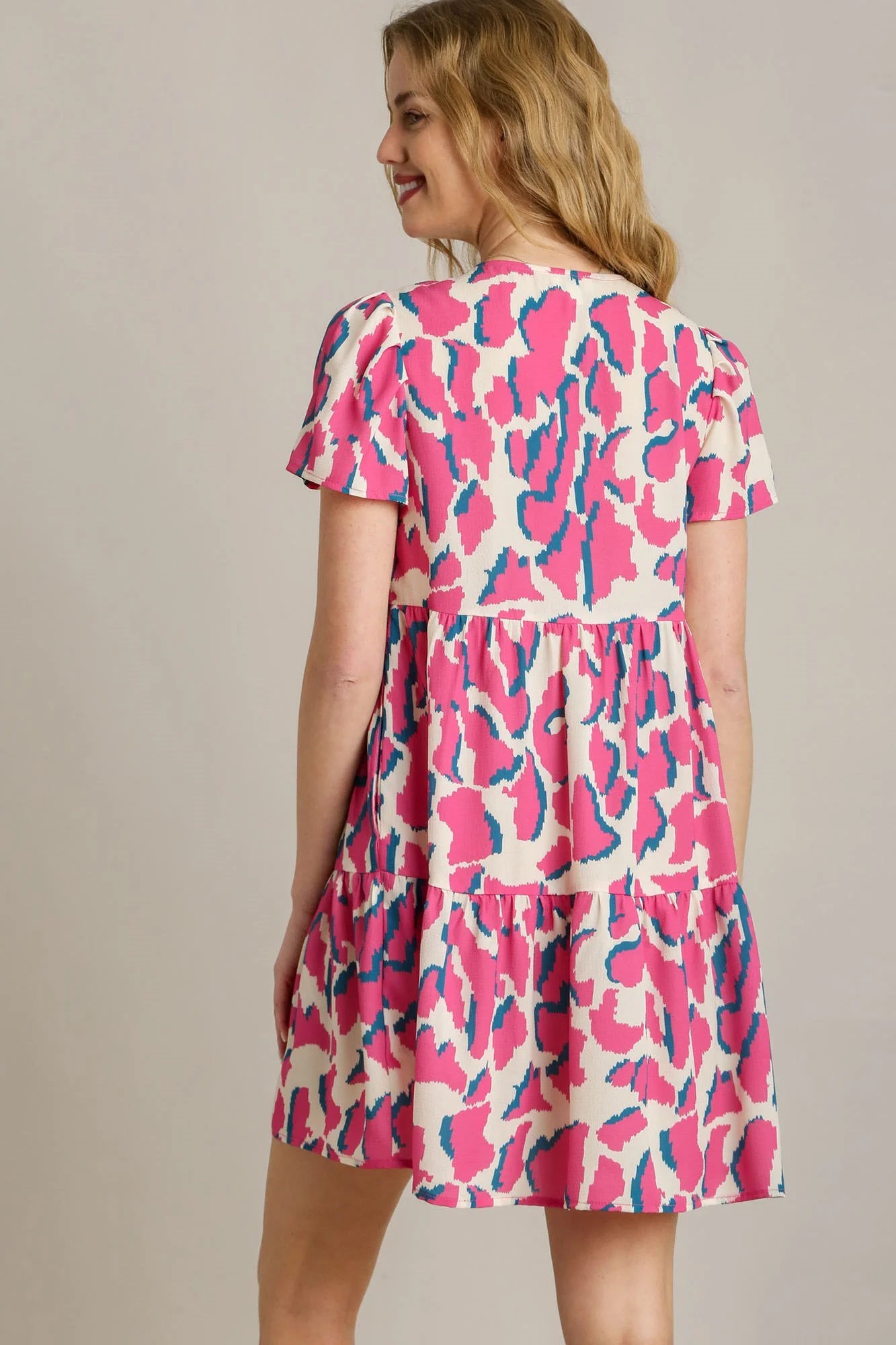 Umgee Full Size Abstract Print Pleat Detail Short Sleeve V-Neck Tiered Dress plus Size